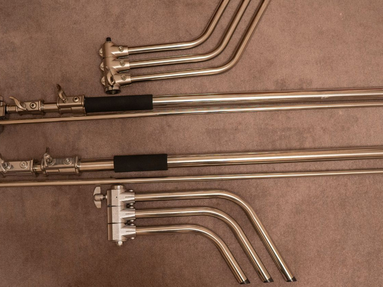 2x heavy duty c- stands with avenger arm and swivel joint.
