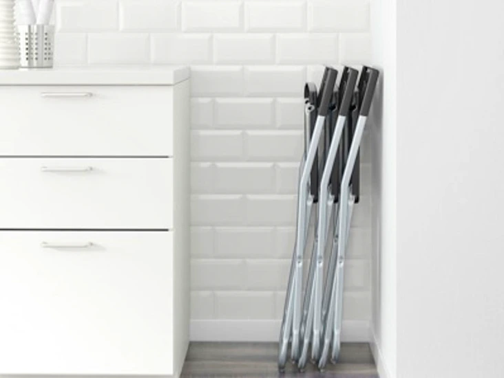 5 black folding party chairs