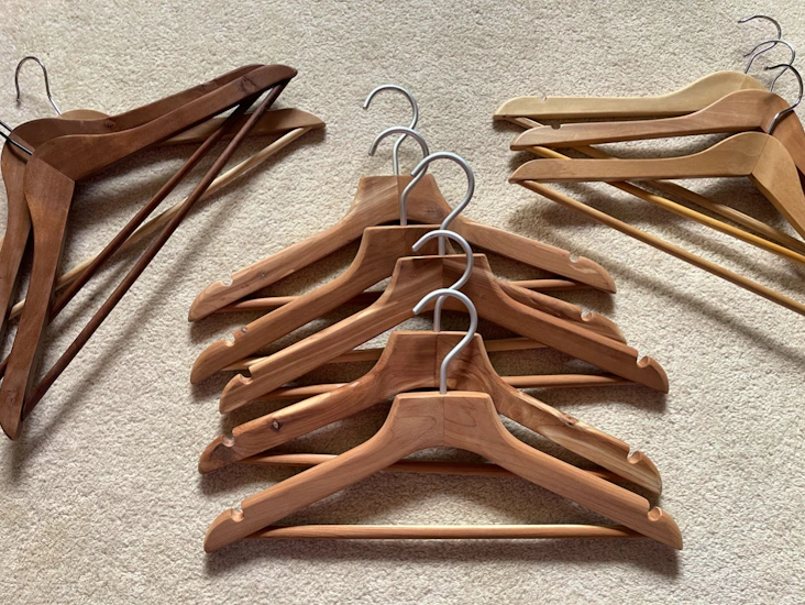 A set of 20 wooden clothing hangers (muji, cedar, oak etc)
