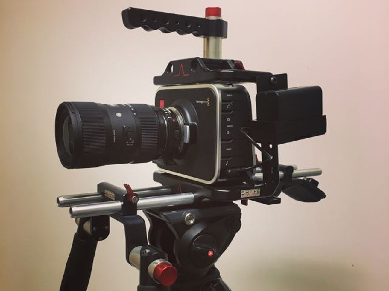 Full kit blackmagic cinema camera (2.5k) with sigma f 1.8 18-35mm lens, tripod&rig.