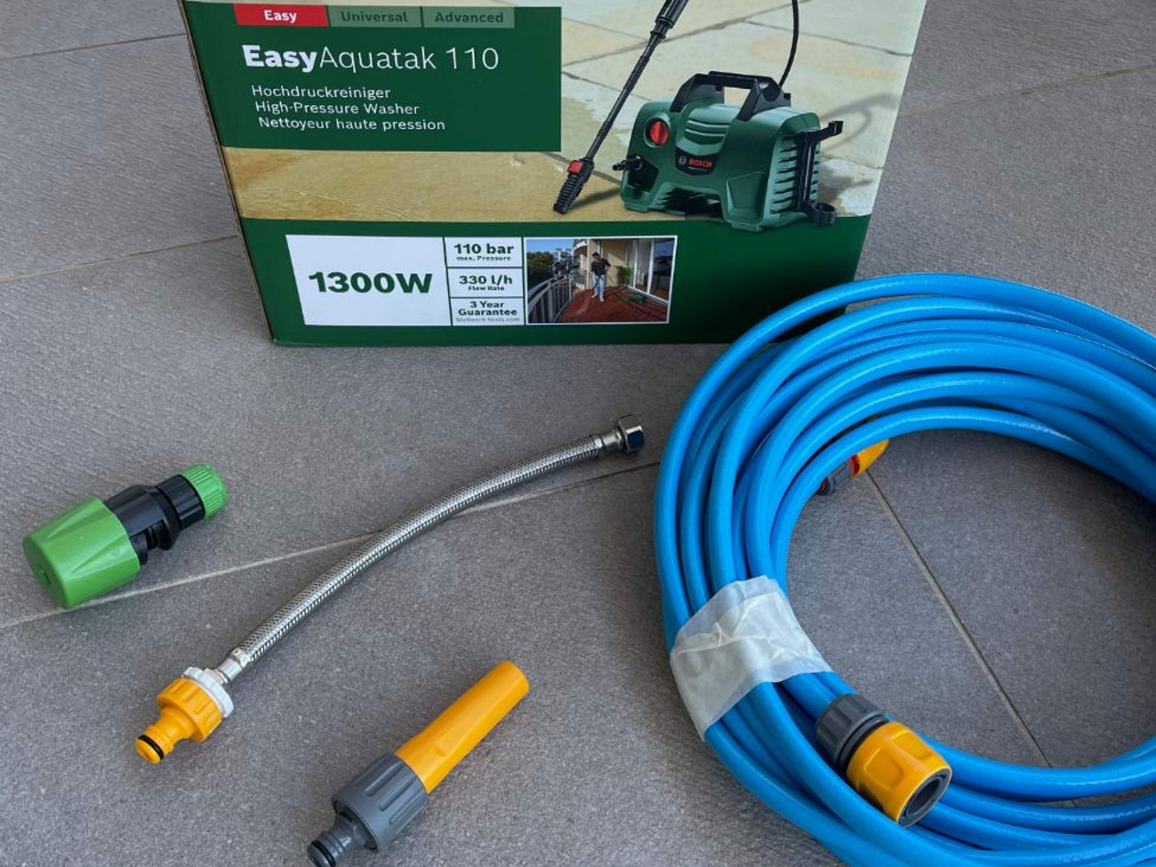 Bosch pressure washer with hose and adapters