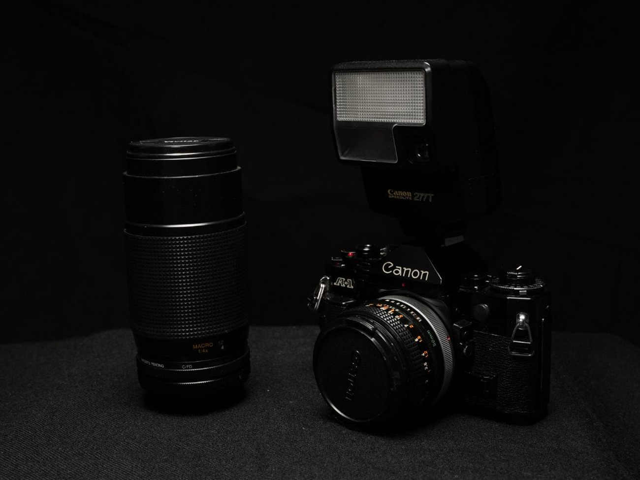 Canon a-1 film camera + 50mm 1.8 + 70-200 + flash