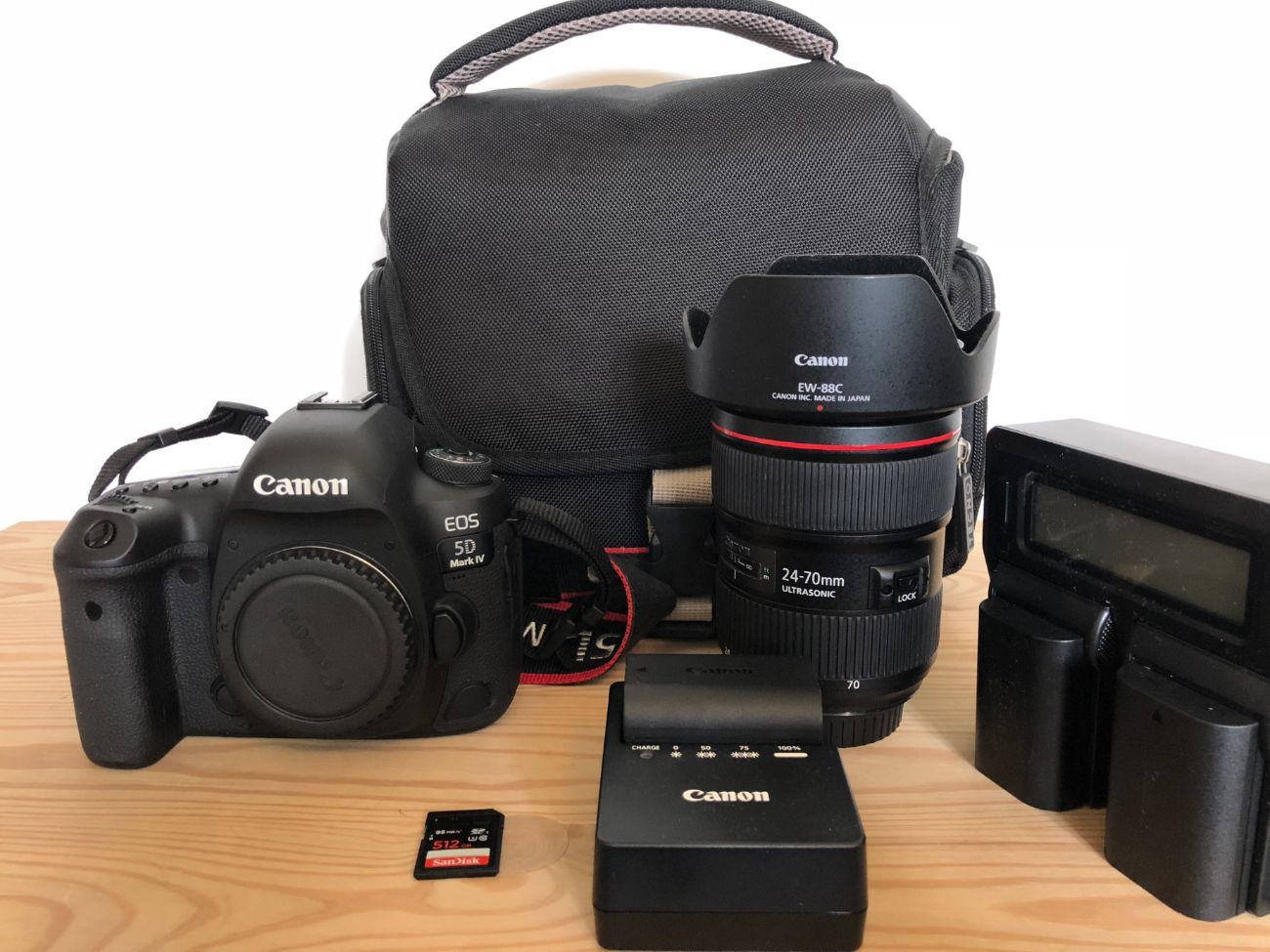 Canon mark iv +   ef 24-70mm f2.8l + 512 gb sd card & 256 gb cf card+  carry case & batteries 