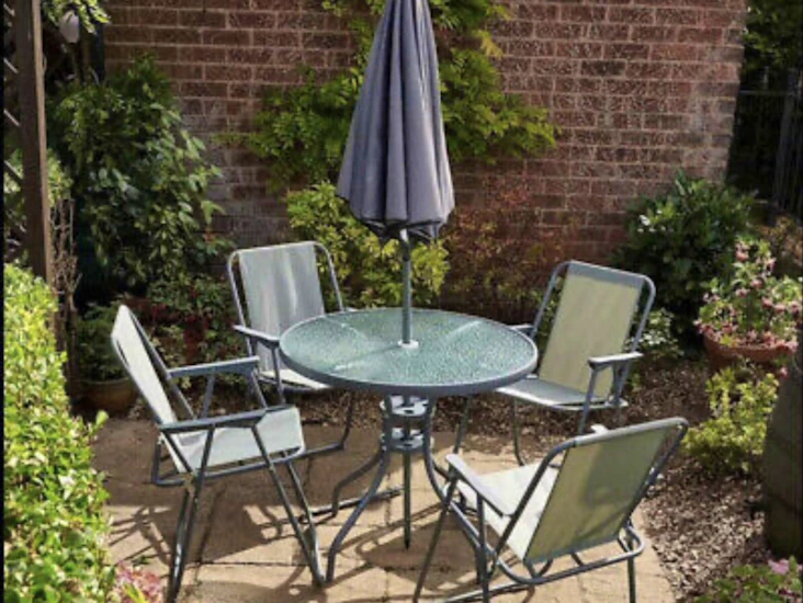 Garden dining table chairs and umbrella