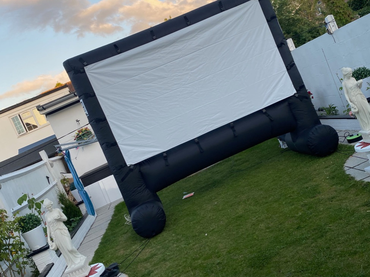 Inflatable outdoor movie screen and projector