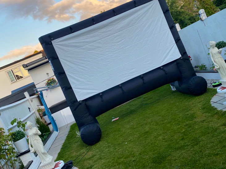 Inflatable outdoor movie screen and projector