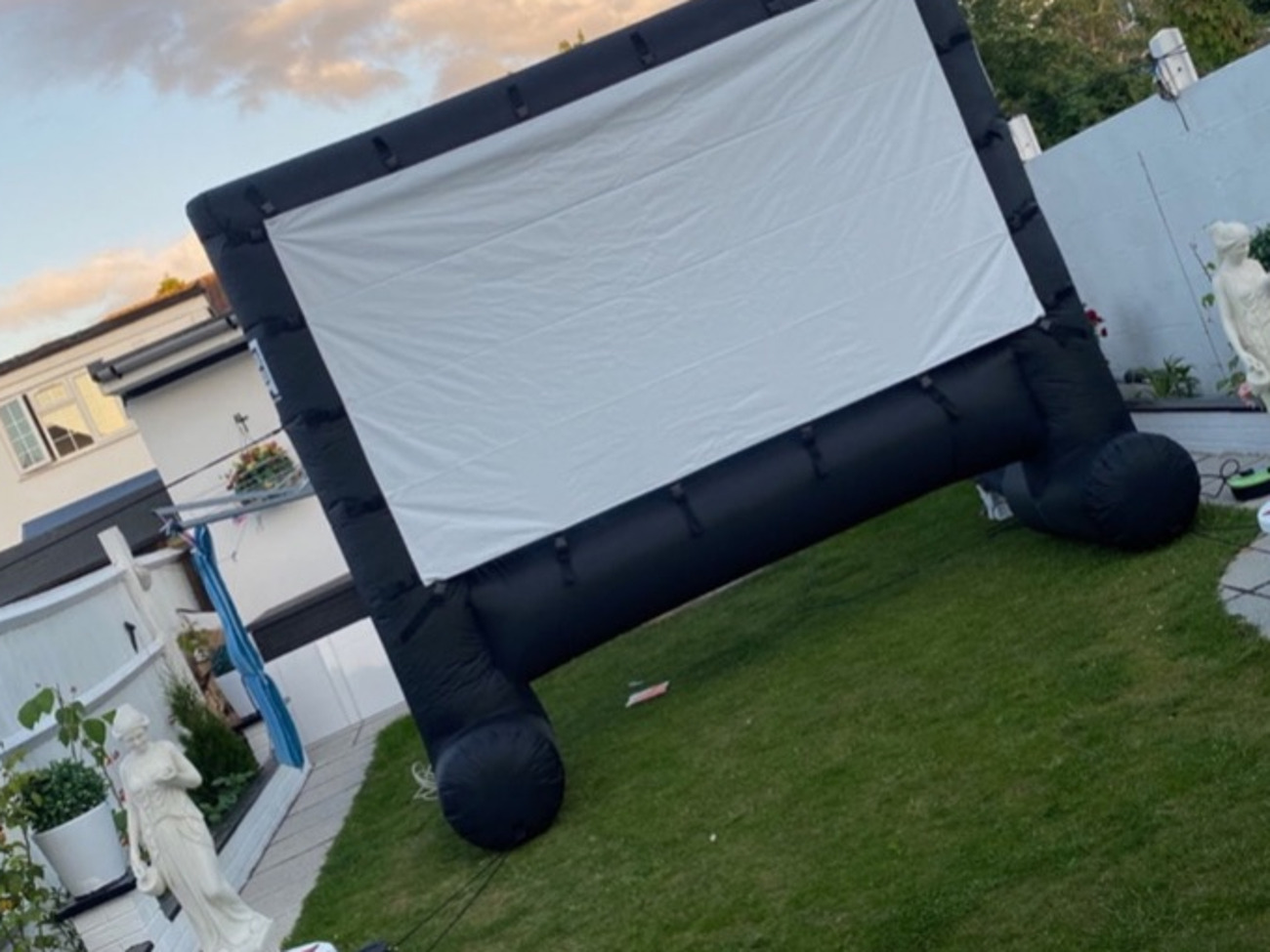 Inflatable outdoor movie screen, projector and speakers