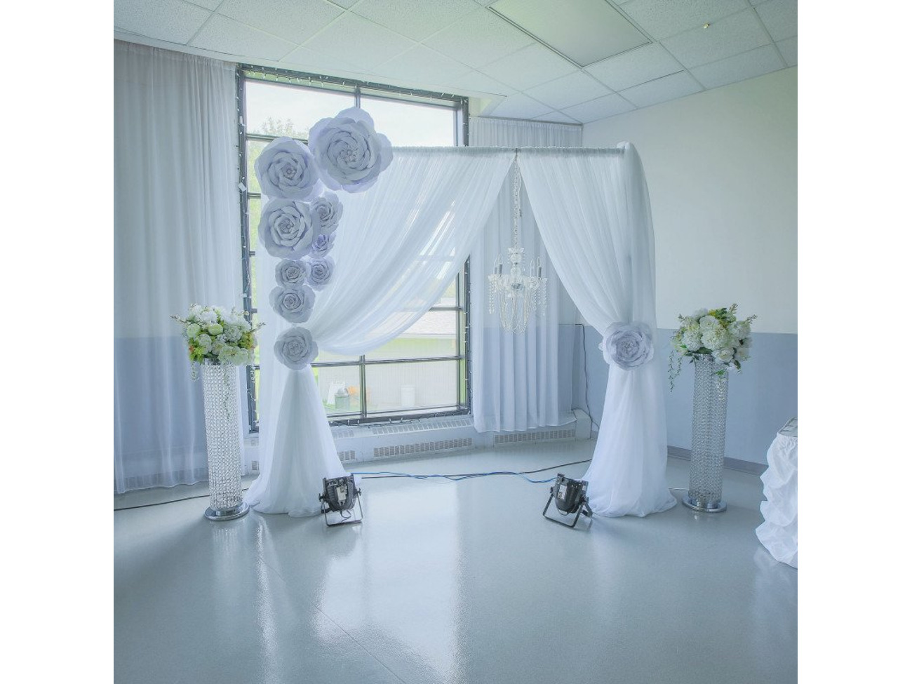 Metal arch with white backdrop - or any color , chandelier and flower decors