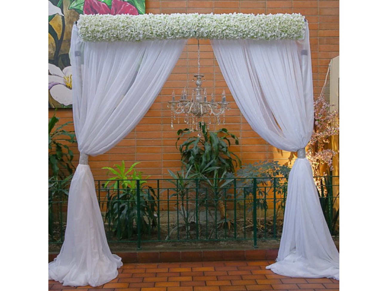 Metal arch with white backdrop - or any color , chandelier and silk flowers