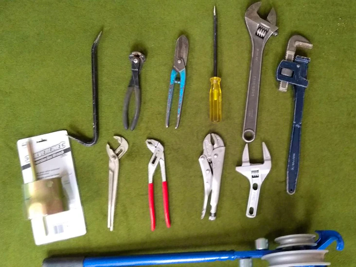 Diy plumber tools- pipe bender; crowbar; multigrips; spanners immersion cutter etc