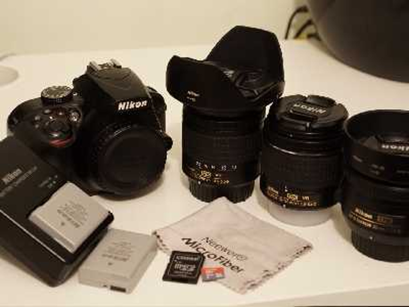 Nikon d3400 + 3 lenses, batteries, sd card & more