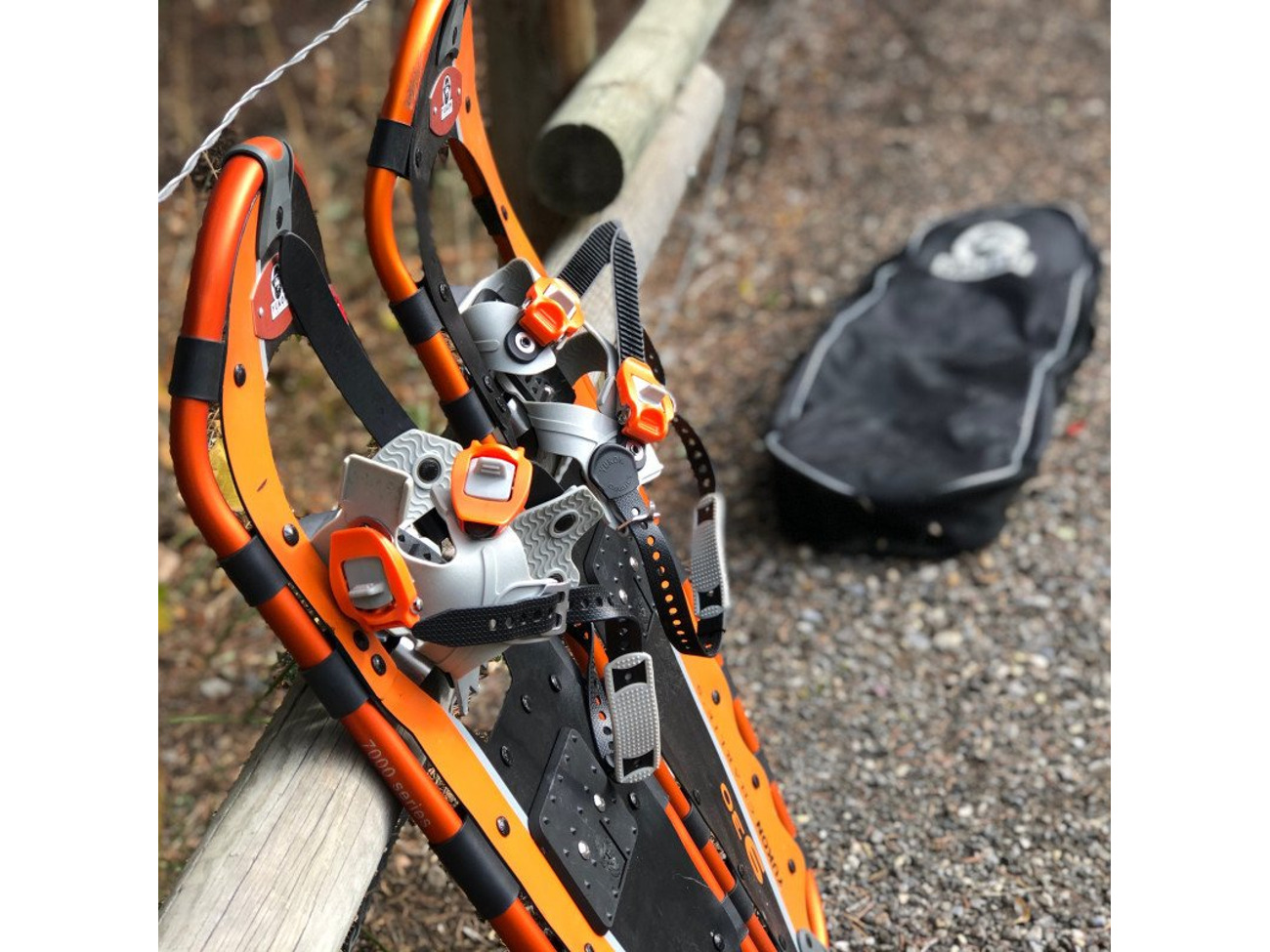 Orange adult snow shoes with bag