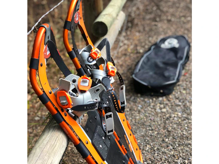 Orange adult snow shoes with bag