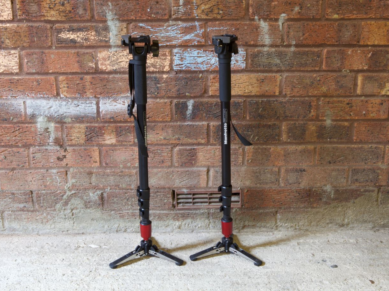 Pair of manfrotto fluid video / camera monopods with head