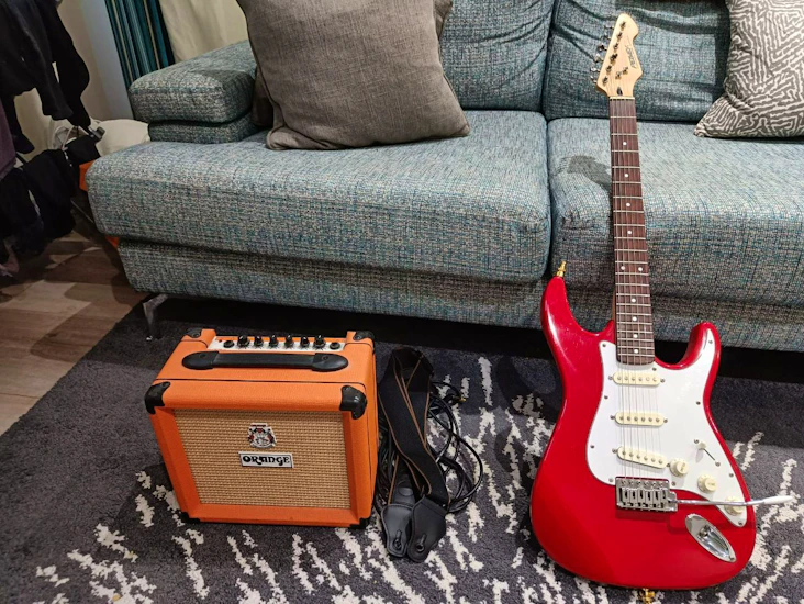 Peavey raptor electric guitar and orange crush 12 combo