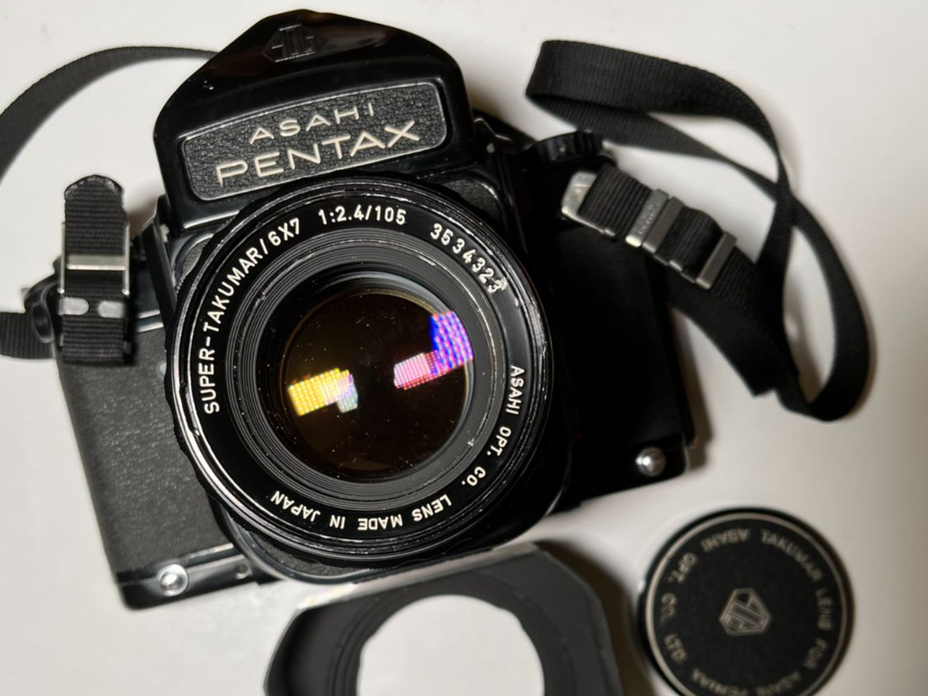 Pentax 6x7 with 105mm f2.4 lens, hood and caps