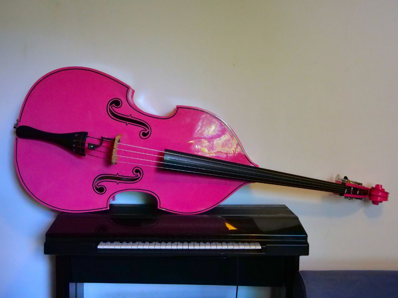 Pink double bass with pickup. 