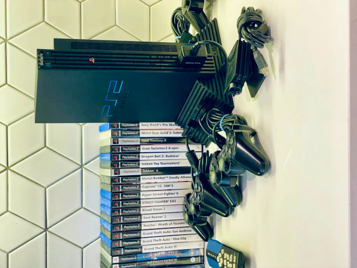 Playstation 2 with 4 controllers, memory cards and games