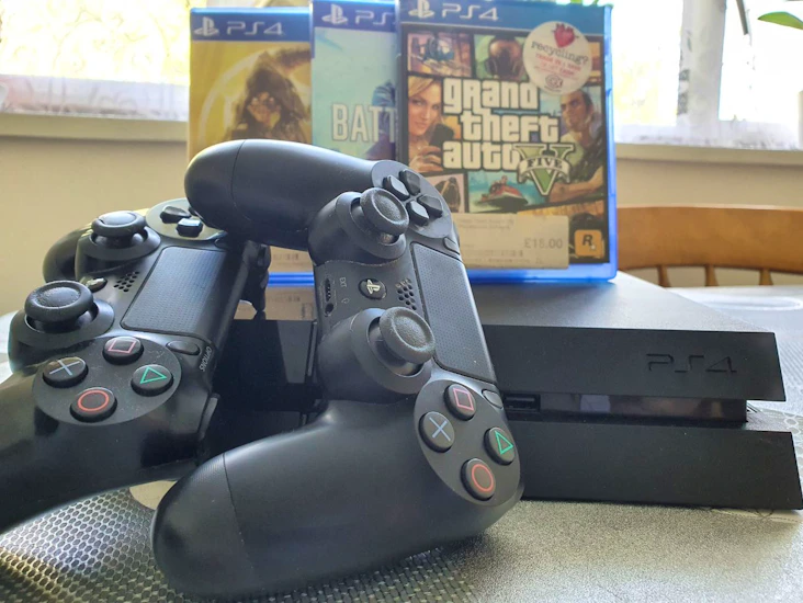 Playstation 4 and 3 games plus another one inside