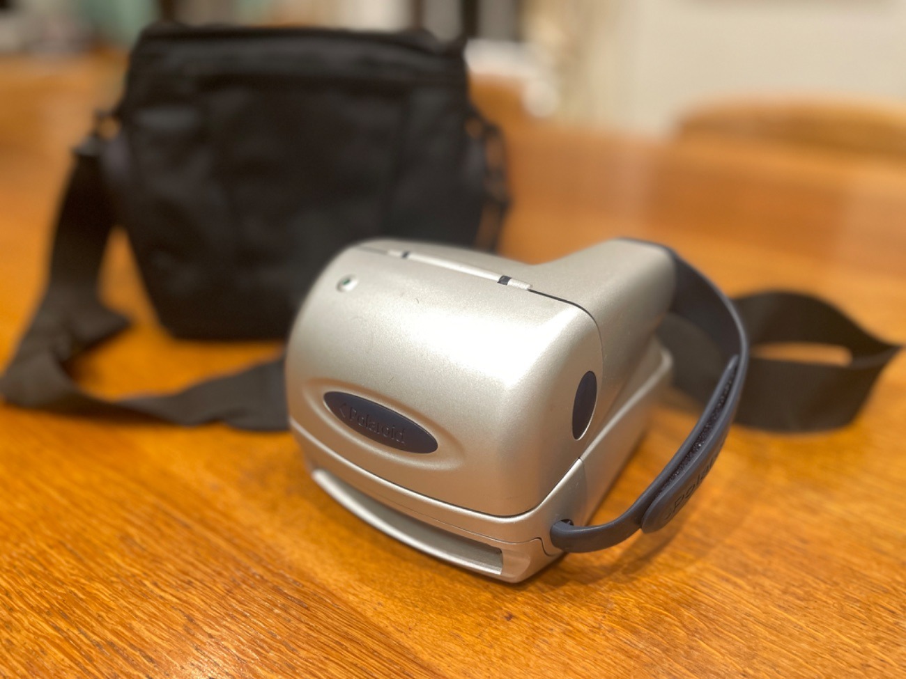 Polaroid camera with caring case