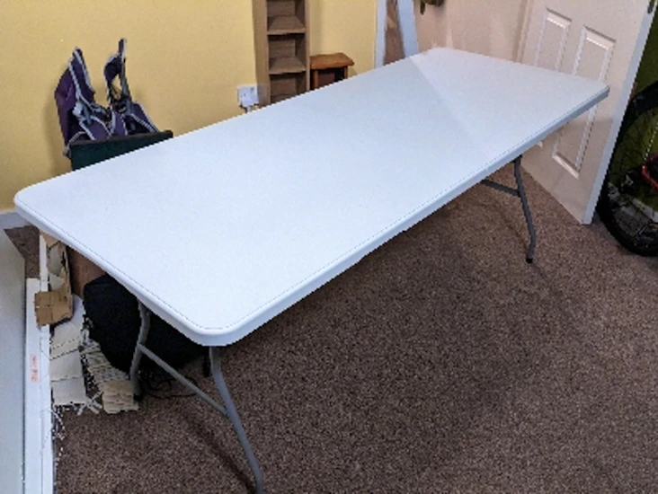 Portable banquet table and 8 folding chairs