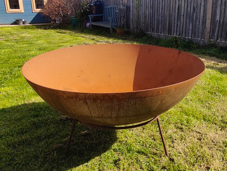 Rustic outdoor fire pit and stand