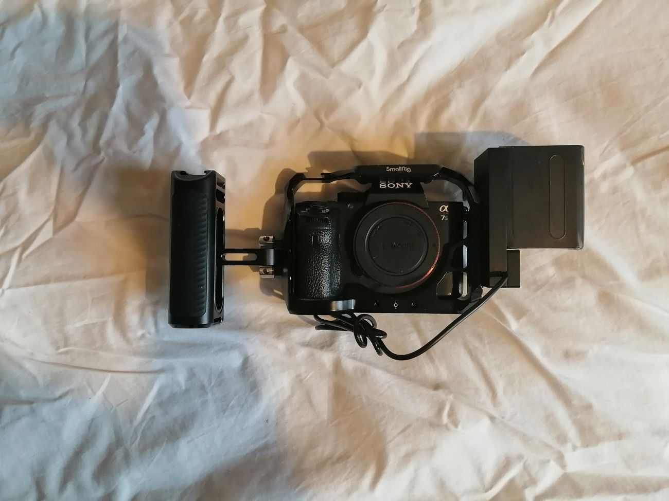 Sony a7s ii body w/ cage & handle, np-f adapter w/ battery