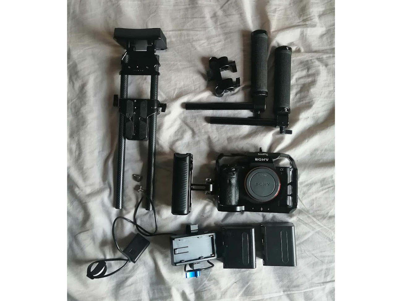 Sony a7s ii body w/ cage, chest rig, 2 np-f970 batteries