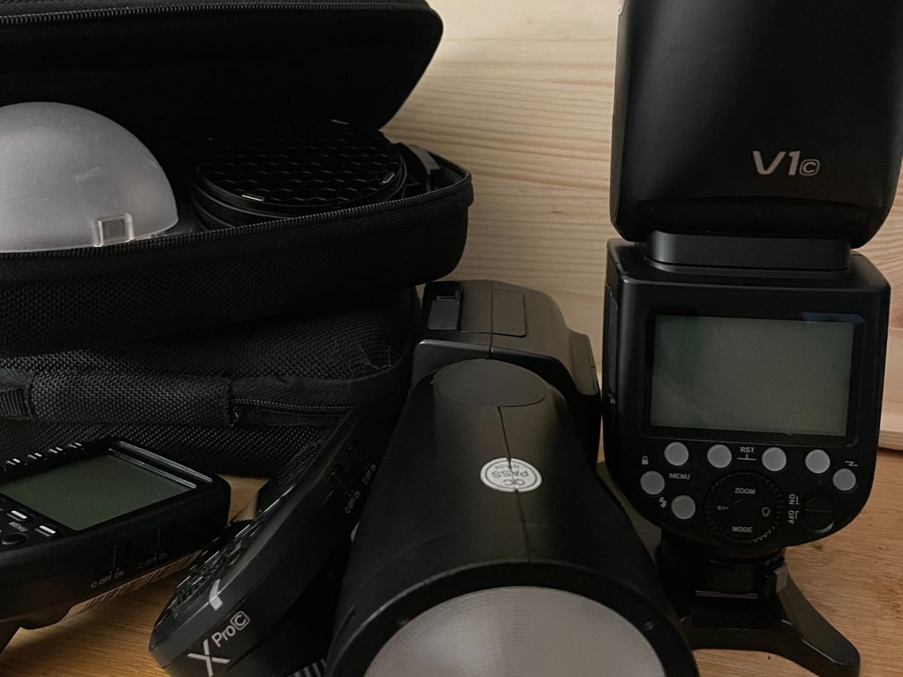 Two godox v1 flashes w/transmitters and accessories (canon)