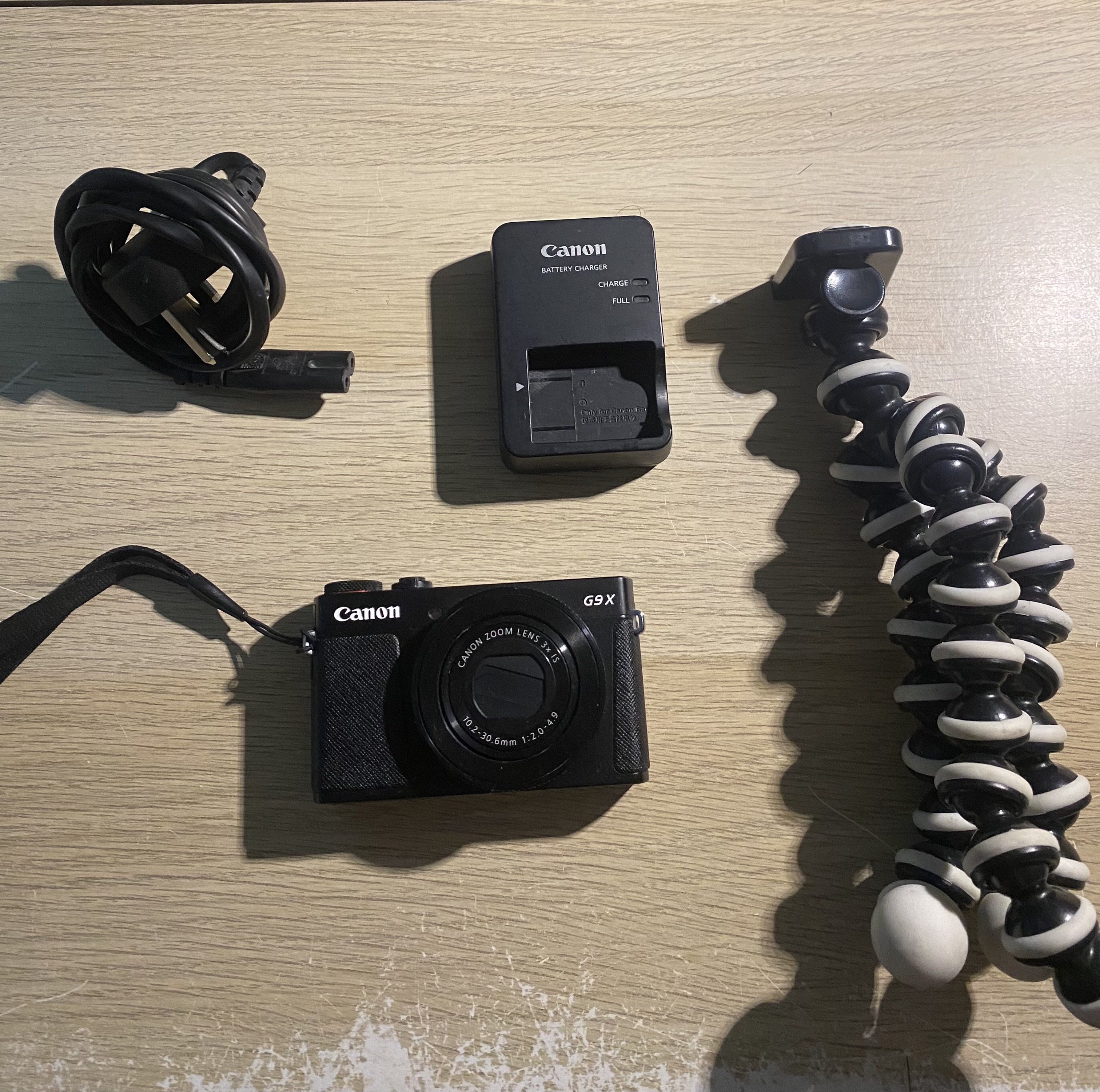 Canon powershot g9x digital camera with gorilla tripod and battery charger