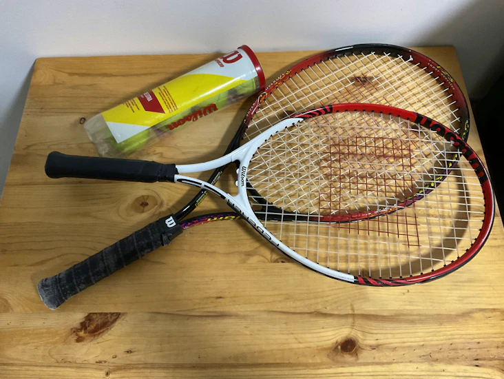 Tennis rackets with tennis balls