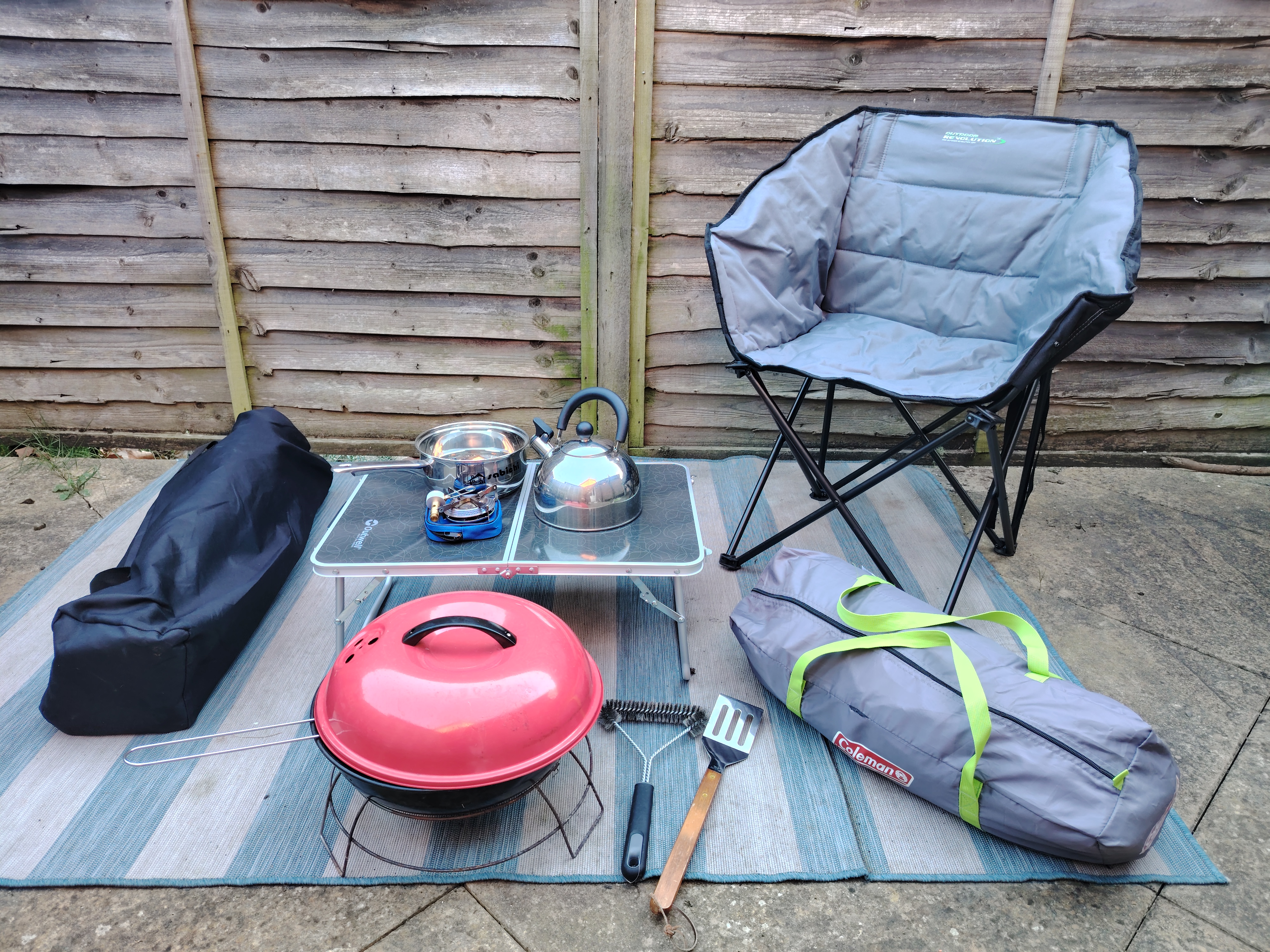 2 person tent with 2 camping chairs, table, stove top, kettle, saucepan, bbq