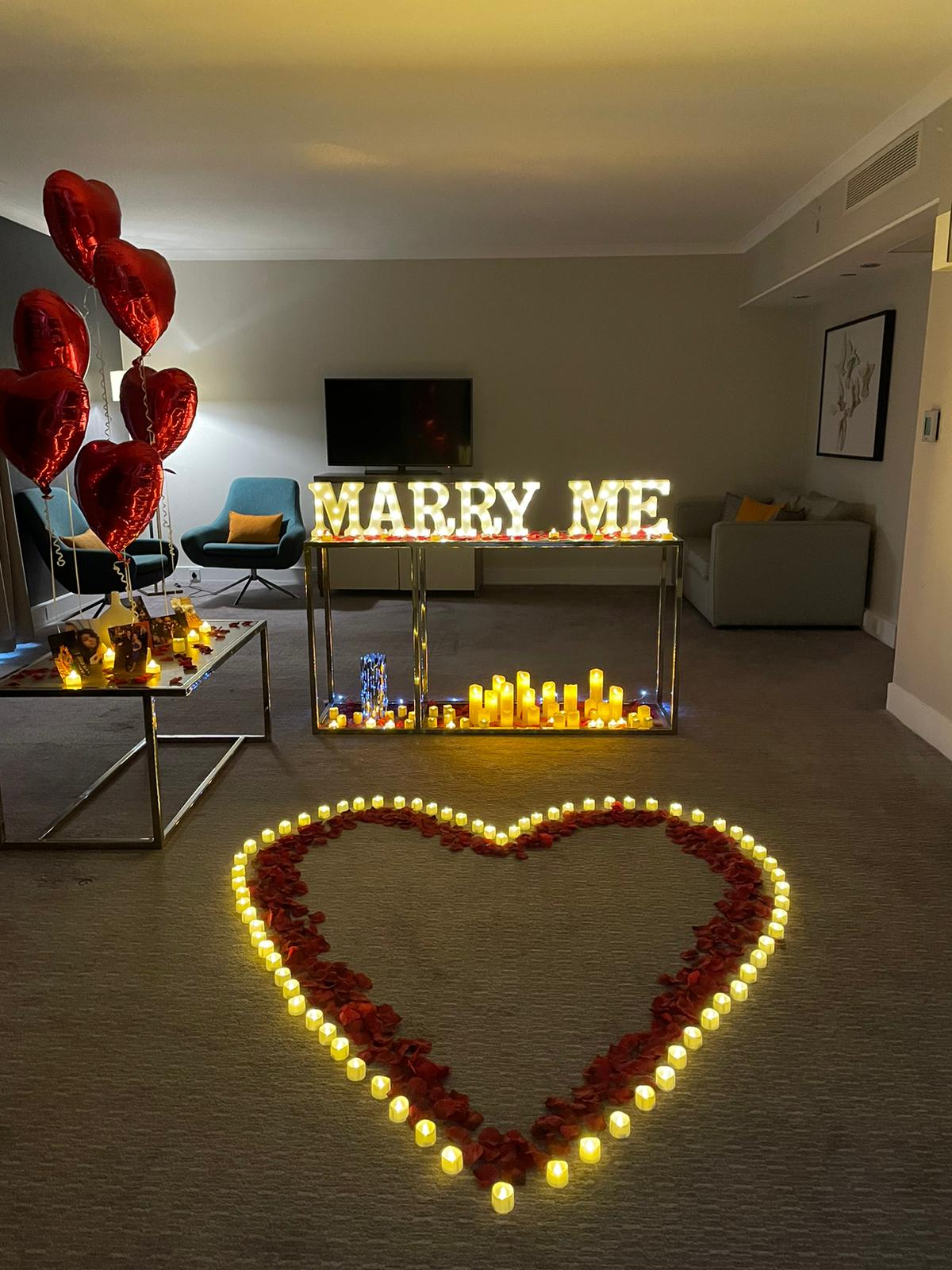 Marry me proposal led lights with led candles, tea light candles and red rose petals