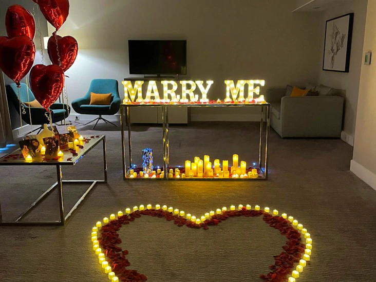 Marry me proposal led lights with led candles, tea light candles and red rose petals
