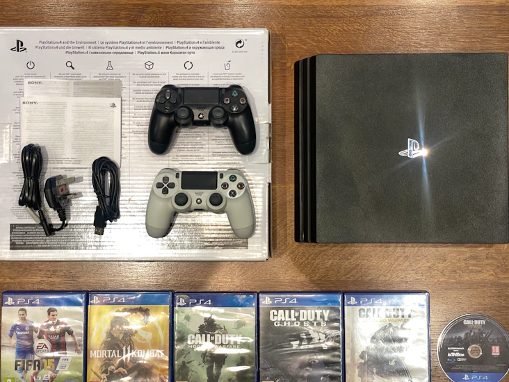 Ps4 bundle. x2 wireless controllers x6 popular games. comes boxed ready to go!