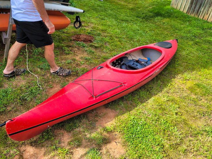 Rent a red 11ft sit-in kayak with paddle!