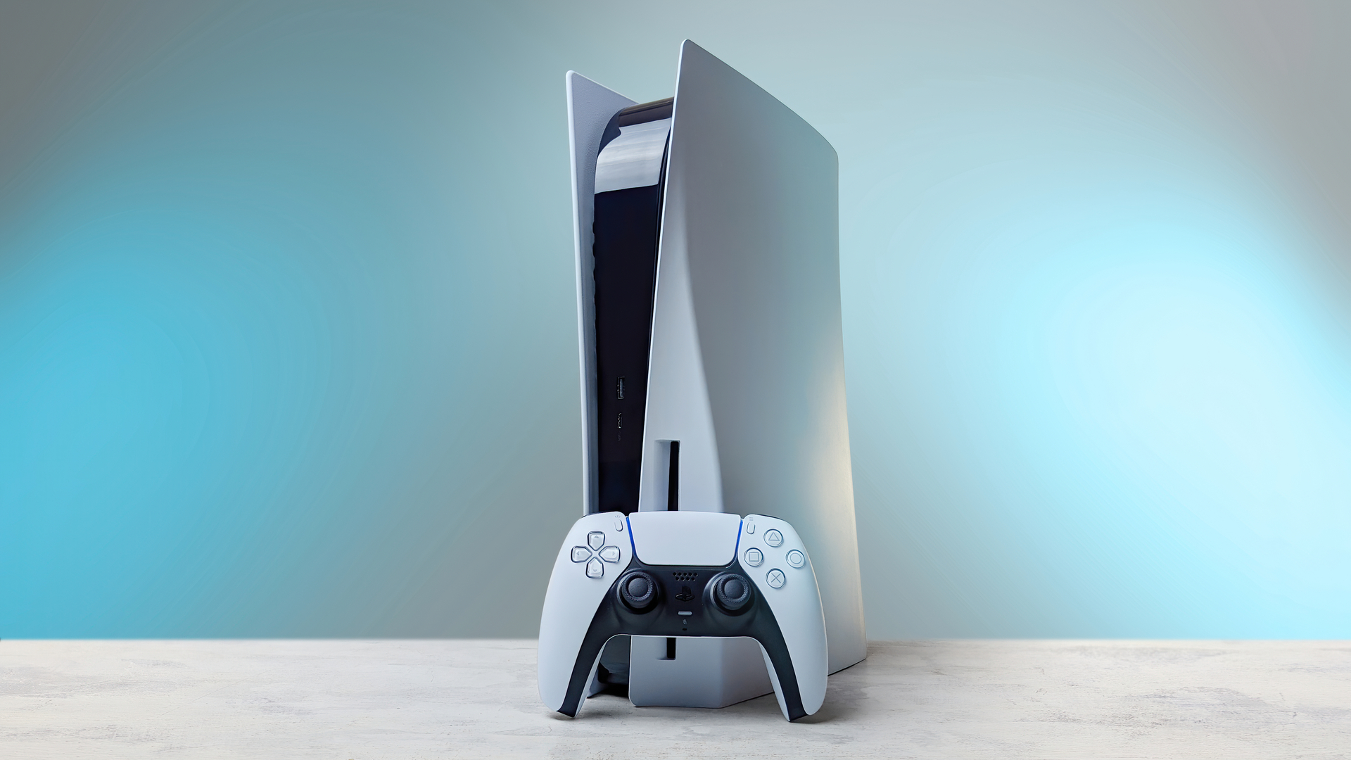 Playstation 5 med handkontroll och spel