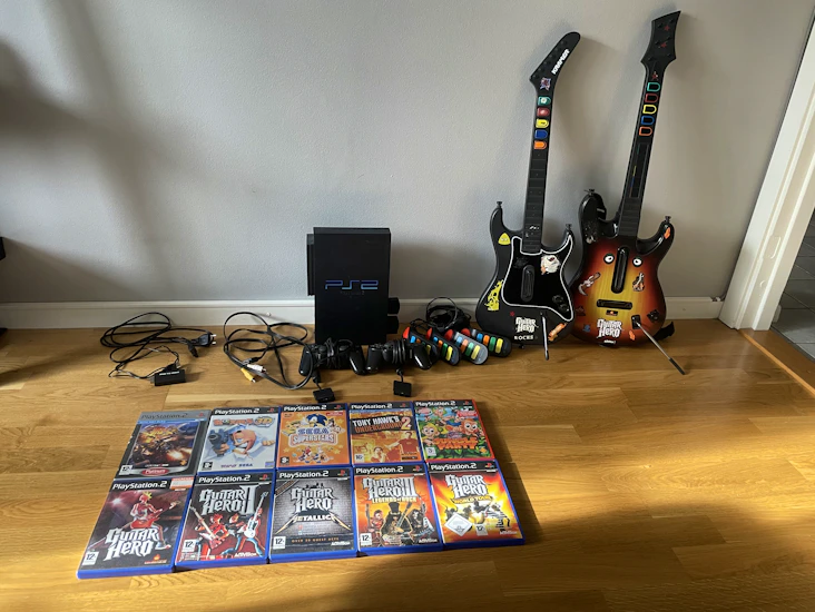 Playstation 2 + guitar hero & buzz