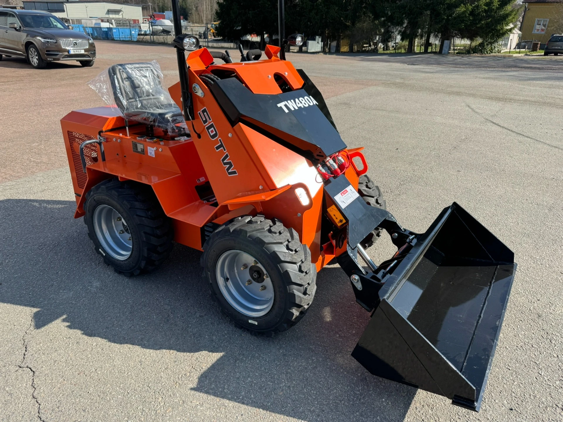 Minilastare kompaktlastare skidsteer sitt transport ordnas