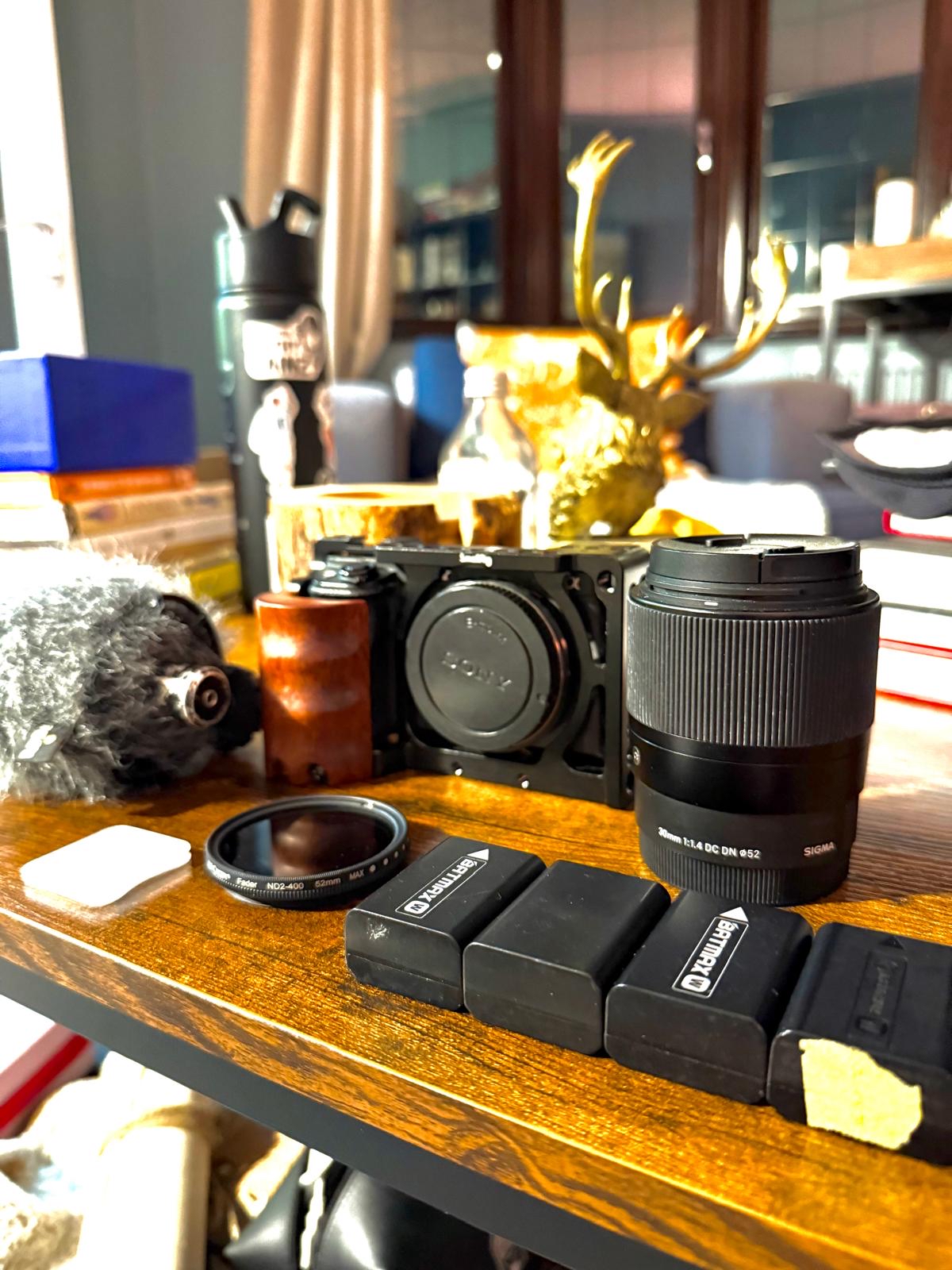 Sony a6300 + sigma 30mm f/1.4 lens + rode microphone + full accessories kit