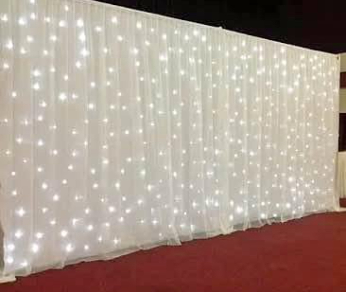 White backdrop with light and stand for hire.