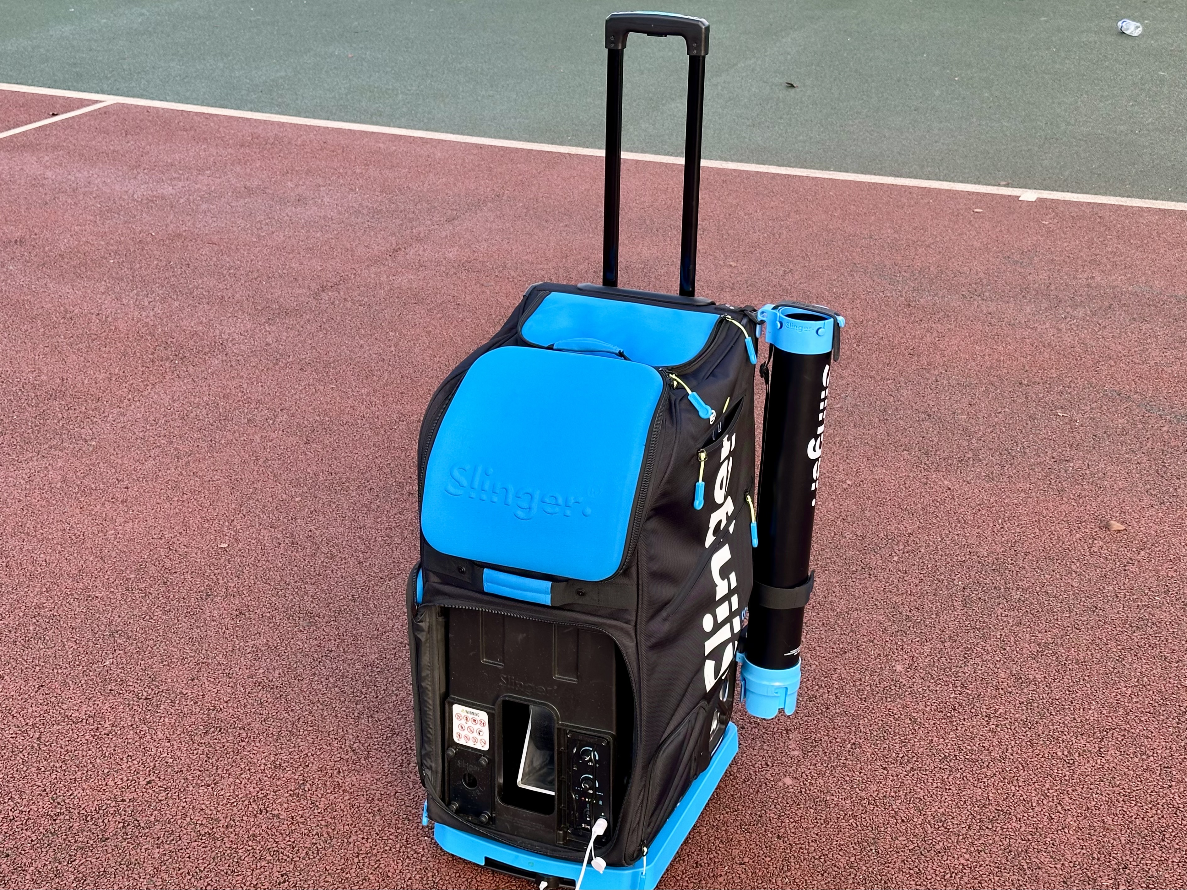 Tennis ball machine with balls