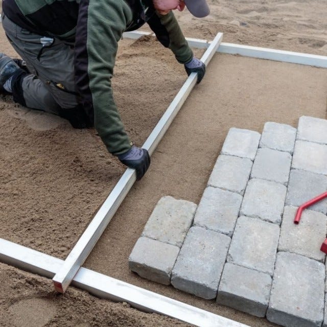 Avrettnings planke for belegningsstein