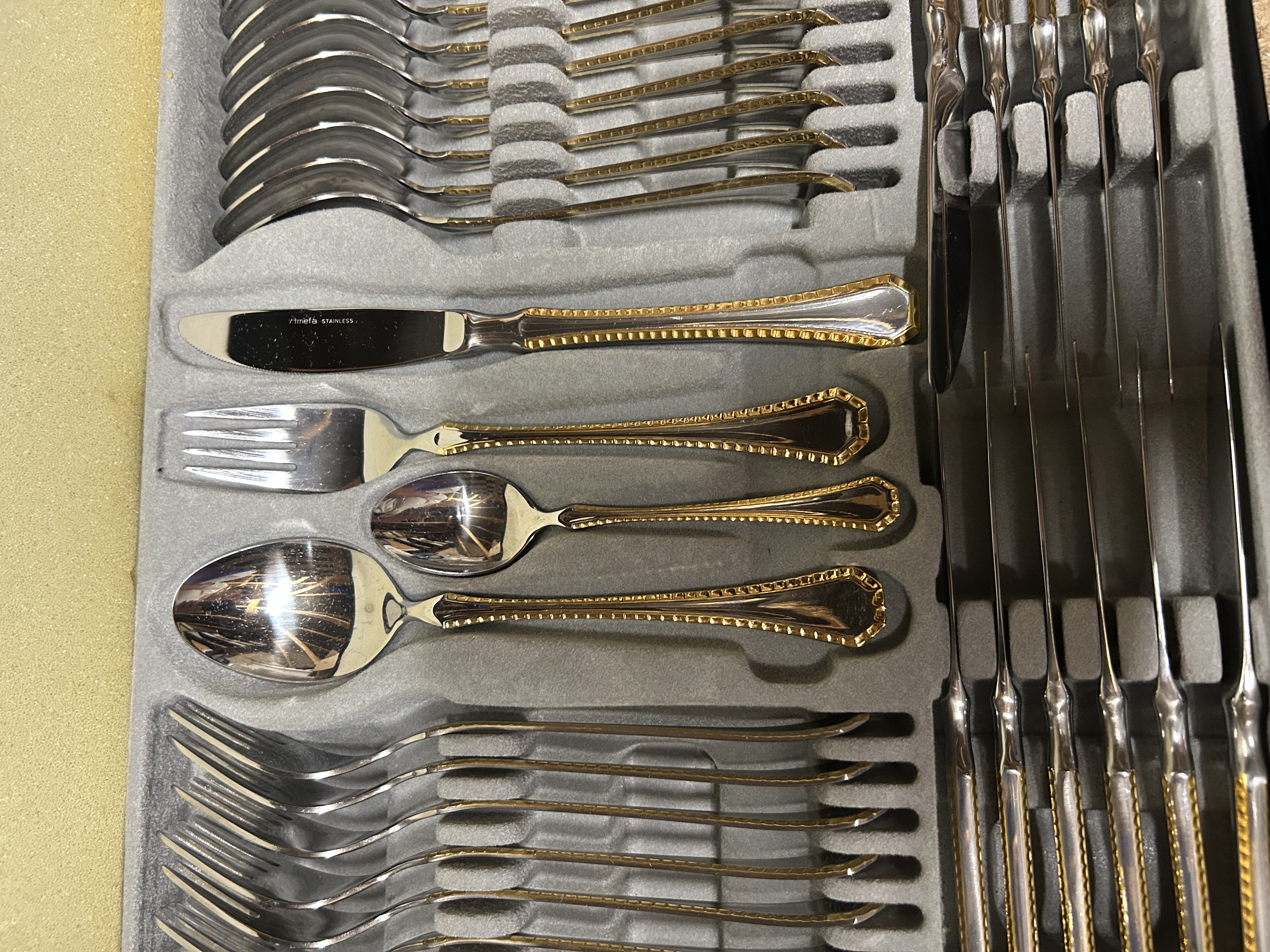 Silver/gold cutlery set for 12