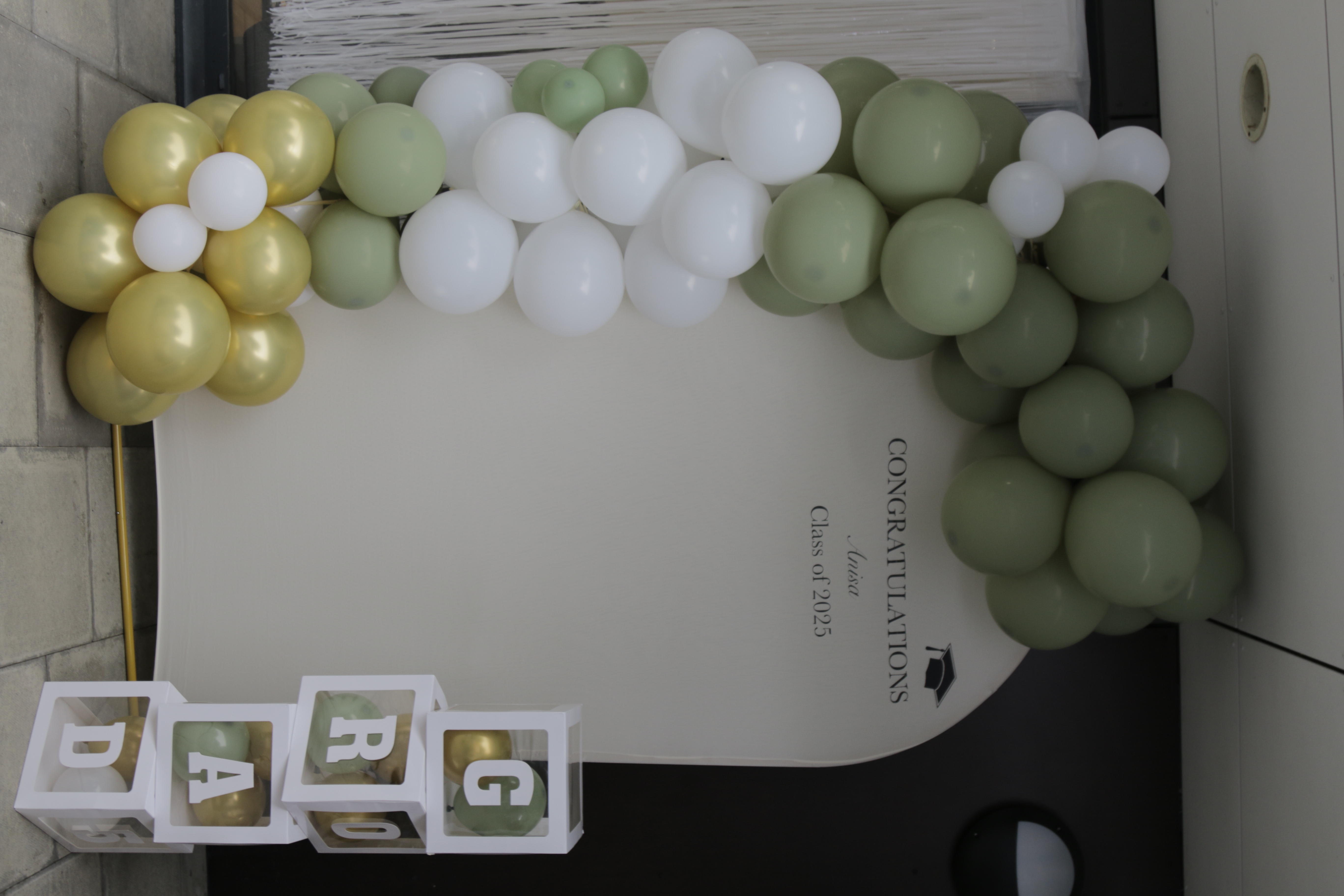 Background arch with custom black vinyl words — balloon arch optional