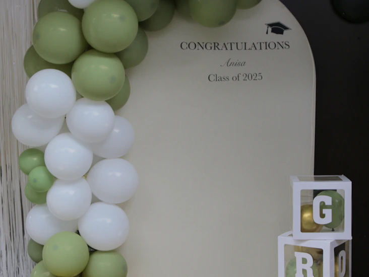 Background arch with custom black vinyl words — balloon arch optional