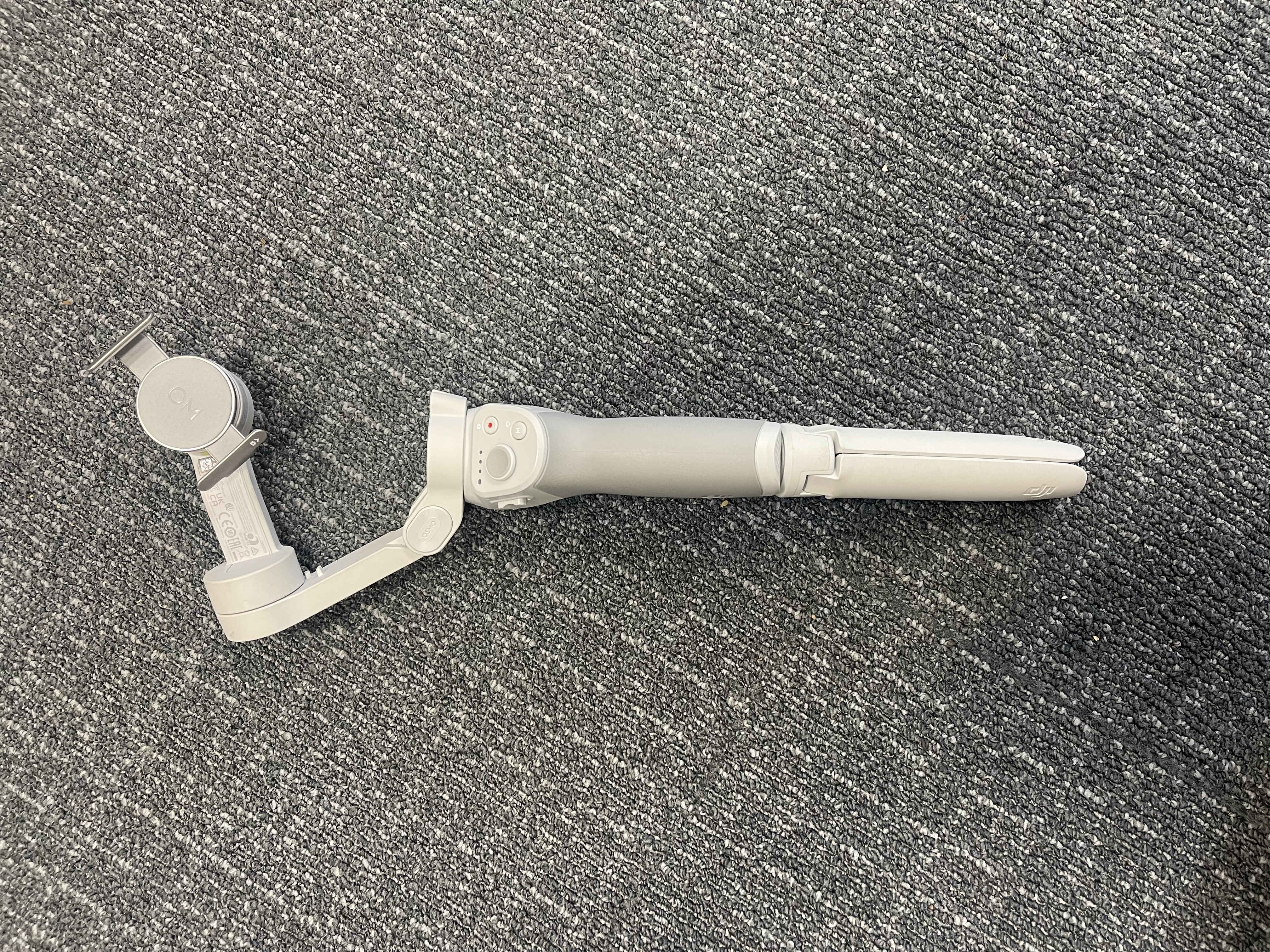 Dji om/osmo series smartphone gimbal with a built-in tripod