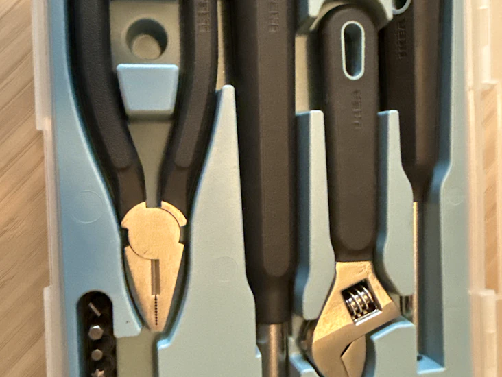 Tool box including hammer, rubber damper, wrench, pliers and screwdriver