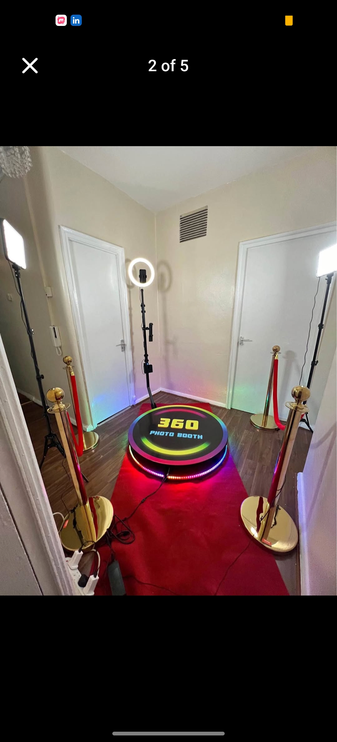 360 degrees photo booth with red carpet and stanchions