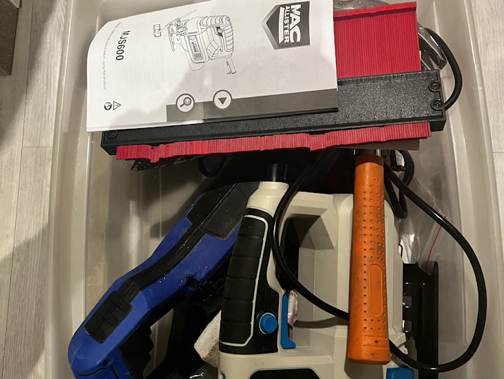 Diy box including jigsaw, reciprocating saw and electric sander.